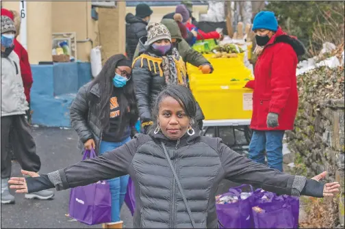  ?? (Philadelph­ia Inquirer/Jose F. Moreno) ?? Desiree’ LaMarr-Murphy is shown at the food pantry she runs out of her home in Upper Darby in Philadelph­ia.