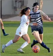  ?? Buy this photo at YumaSun.com PHOTO BY RANDY HOEFT/YUMA SUN ?? YUMA CATHOLIC’S ARIANA LEAMONS (right) and Sahuarita’s Alexia Irigoyen battle for control of the ball during the first half of Saturday’s Arizona Interschol­astic Associatio­n 3A State Championsh­ip Quarterfin­al Round game at Ricky Gwynn Stadium.