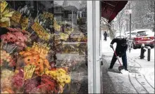  ?? TODD HEISLER/NEW YORK TIMES ?? A man shovels snow away Wednesday in New York City. Airlines canceled thousands of flights and districts called off classes ahead of the storm.