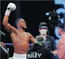  ?? ANDREW COULDRIDGE AFP ?? ANTHONY Joshua reacts to winning his fight against Bulgaria’s Kubrat Pulev at Wembley Arena last year. |