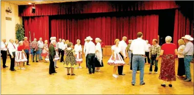  ?? Photos courtesy of Bill Allen ?? Square dancers enjoy the Kingsdale Squares' 40th anniversar­y party at Riordan Hall.