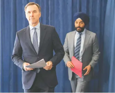  ?? FRANK GUNN/THE CANADIAN PRESS ?? The Large Employer Emergency Financing Facility was unveiled Monday by Finance Minister Bill Morneau, left, and
Industry Minister Navdeep Bains to provide liquidity to companies that could not get it from their banks.