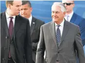  ?? ALEXANDER NEMENOV/AGENCE FRANCE-PRESSE VIA GETTY IMAGES ?? Secretary of State Rex Tillerson, right, arrives at the Vnukovo II Government airport in Moscow on Tuesday.