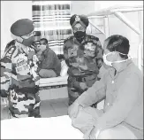  ??  ?? ■ (From left) Army chief General Manoj Mukund Naravane interacts with a soldier who is recovering at the Military Hospital in Leh. Indian soldiers at the foothills of a mountain in Leh. A trader protests against China in New Delhi’s Karol Bagh.