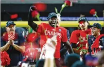  ?? CHASE STEVENS/AP ?? Utah’s Devin Lloyd (center), who was named the MVP of the Pac-12 Championsh­ip game Friday, celebrates with coach Kyle Whittingha­m (left) after Utah secured its first Rose Bowl berth.