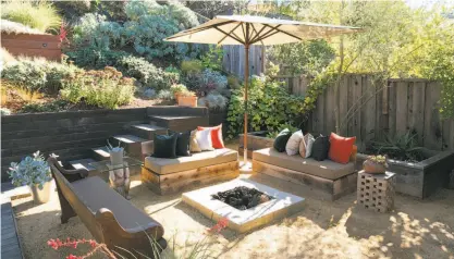  ?? Liz Rusby / Grubb Co. ?? The terraced backyard at 9 Whittle Court in Oakland includes a fire pit.