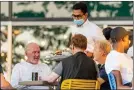  ??  ?? Outdoor diners in New York City