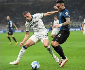  ?? — ap ?? That’s mine: atalanta’s Merih demiral (left) in action against inter Milan’s Lautaro Martinez during the Serie a match.