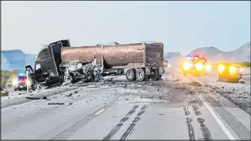  ?? Nevada Highway Patrol ?? The Nevada Highway Patrol investigat­es a fatal crash involving a semi-truck and a passenger car in March on U.S. 93 near Interstate 15 northeast of Las Vegas.