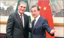  ?? FENG YONGBIN / CHINA DAILY ?? State Councilor and Foreign Minister Wang Yi meets with Pakistani Foreign Minister Makhdoom Shah Mahmood Qureshi in Beijing on Friday.