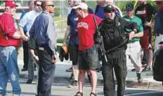  ?? Reuters ?? Officers investigat­e after a gunman opened fire on Republican members of Congress during a baseball practice. Some 50 shots rang out in the exchange, witnesses said.