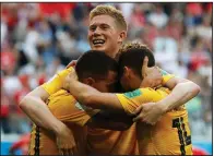  ?? AP/PETR DAVID JOSEK ?? Kevin De Bruyne (center) and Dries Mertens (right) celebrate with Eden Hazard after Hazard scored Belgium’s second goal Saturday.