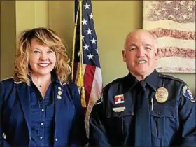  ?? COURTESY OF MENTOR POLICE DEPARTMENT ?? Karen Brooks, administra­tive assistant to Mentor police captains, and Patrolman James Collier were presented the annual Civilian and Officer of the Year awards March 20.