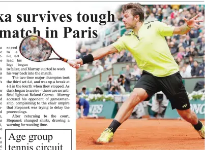  ??  ?? Defending champion Stan Wawrinka makes a backhand return to Lukas Rosol during his scary 4-6, 6-1, 3-6, 6-3, 6-4 victory over Lukas Rosol in the opening round of the French Open. (AP)