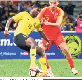  ??  ?? Talented: Pahang’s R. Dinesh (left) impressed in the recent AFC Under-23 Championsh­ip qualifiers.