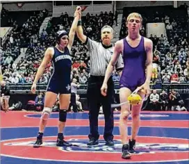  ?? BO VINESS / STATESBORO WRESTLING ?? Kasey Baynon of Statesboro High School is declared the winner in the fifth-place match over Tripp Sauls of Villa Rica High School last month during the GHSA state wrestling championsh­ips.