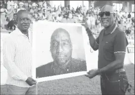  ??  ?? From one captain to another: Sir Vivian Richards (right) receives the portrait from Sir Richie Richardson at the Vivian Richards Cricket Ground.