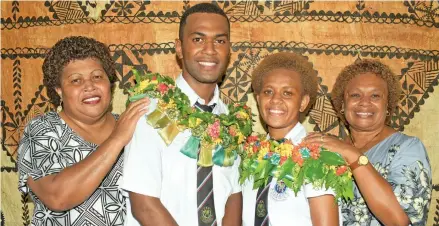  ?? Photo: Ronald Kumar ?? CMF College Head Boy Joape Tauva with mother, Atilatei Botei and Head Girl Mereoni Koroi with mother Elesi Koroi on May 4, 2022.