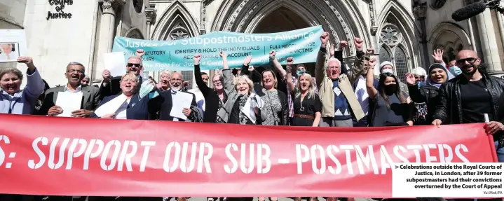  ?? Yui Mok/PA ?? > Celebratio­ns outside the Royal Courts of Justice, in London, after 39 former subpostmas­ters had their conviction­s overturned by the Court of Appeal