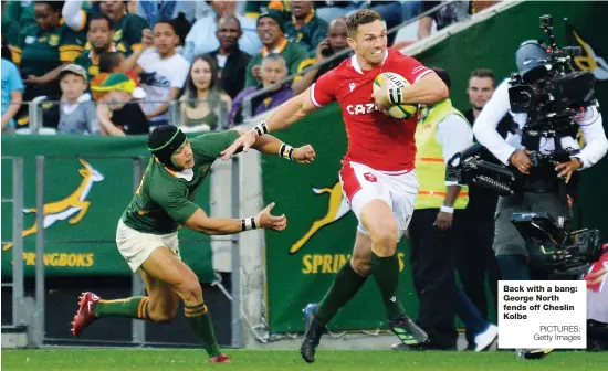  ?? PICTURES: Getty Images ?? Back with a bang: George North fends off Cheslin Kolbe
