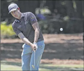  ?? Gerry Broome The Associated Press ?? Co-leader Webb Simpson chips onto the green Saturday during the third round of the RBC Heritage at Hilton Head Island, S.C.