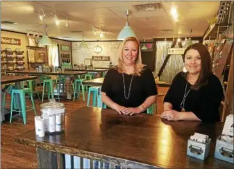  ?? DONNA ROVINS — DIGITAL FIRST MEDIA ?? AR Workshop is a DIY studio at 1810 Swamp Pike in New Hanover where customers can make home decor items from wood or canvas. Shown here are owners Kelly Elliott, left, and Michelle Shilling.