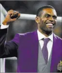  ??  ?? The Associated Press Former Minnesota wide receiver Randy Moss celebrates with the crowd on
Sept. 11, 2017, as he’s inducted into the Vikings Ring of Honor.