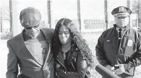  ?? KEVIN RICHARDSON/BALTIMORE SUN ?? Keith Smith and his daughter Valeria met with the media on the corner of Valley and East Chase streets near the scene of the fatal stabbing of his wife, Jacquelyn Smith, on Dec. 1, 2018. Then-interim Police Commission­er Gary Tuggle stands near them.