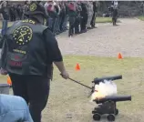  ?? ?? MOTH biker, Anthony van Tonder, lit one of the two canons at the bikers’ parade.