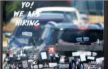  ?? Illinois. (AP) ?? In this April 1, 2022 photo, a hiring sign is displayed at a restaurant in Schaumburg,