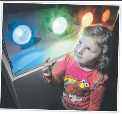  ?? Picture: Nev Madsen ?? COLOUR POP: Emilia Kuhn, 4, explores the science of colour at the Cobb and Co Museum in Toowoomba.