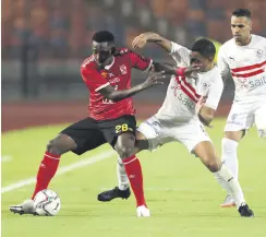  ??  ?? Al Ahly’s Junior Ajayi (L) in action with Zamalek’s Mostafa Mohamed Ahmed Abdalla during an Egyptian Premier League match in Cairo, Egypt, Aug. 22, 2020.