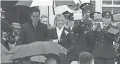  ?? JASON MINTO/DELAWARE NEWS JOURNAL ?? Lt. Gov. Bethany A. Hall-Long and her husband, Dana, walk out into the rain for an inaugurati­on ceremony at Legislativ­e Hall in Dover in 2017.