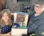  ?? Pennie Wredberg / Courtesy photo ?? Lighthouse students Addy and Damian went shopping together for supplies for their ocean-themed birthday box. They had a very specific list of items they wanted to include, right down to a blue frosting to make the cake look like the sea.