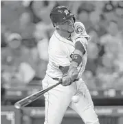  ?? Karen Warren / Houston Chronicle ?? Yuli Gurriel, who has gone 10-for22 while hitting safely in six of his last seven games, delivers an RBI single to put the Astros up 2-1 in the fifth Wednesday.