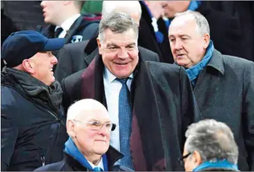  ?? PAUL ELLIS/AFP ?? English football manager Sam Allardyce (centre) arrives in the stands to watch the Premier League match between Everton and West Ham United at Goodison Park in Liverpool on Wednesday.