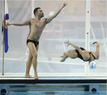  ?? STEVE RUSSELL/TORONTO STAR ?? Canadian Robert Prevost and Isabelle Blanchet-Rampling formed only mixed-duet tandem at the Canadian Open synchro swimming championsh­ips. They’re awaiting word on whether they can compete at the worlds in July.
