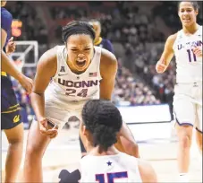  ?? Brad Horrigan / Hartford Courant ?? UConn’s Napheesa Collier (24) reacts to a made basket by teammate Gabby Williams, bottom, against California.