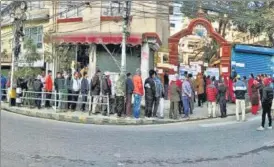  ?? PTI ?? People wait in queues to cast their votes in Kathmandu, Nepal, on Sunday.