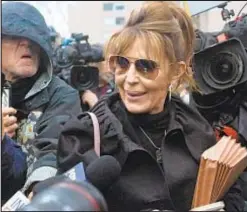  ?? ?? Former Alaska Gov. Sarah Palin leaves Manhattan Federal Court on Thursday as her libel suit against The New York Times continued.