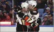  ?? JEFFREY T. BARNES — THE ASSOCIATED PRESS ?? Ducks right wing Frank Vatrano, left, celebrates his goal with Mason Mctavish during Monday’s victory in Buffalo.