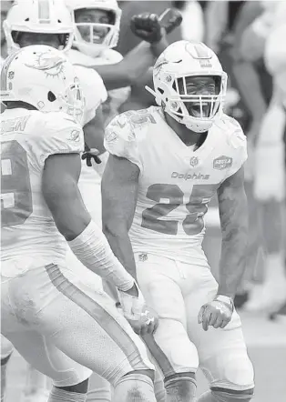  ?? JOHN MCCALL/SOUTH FLRIDA SUN SENTINEL ?? Dolphins cornerback Xavien Howard celebrates after an intercepti­on against the Jets in October at Hard Rock Stadium in Miami Gardens.