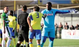  ??  ?? Haringey Borough goalkeeper Valery Pajetat points in the direction of a minority of Yeovil Town supporters following an alleged racist incident. Photograph: James Fearn/James Fearn/PPAUK