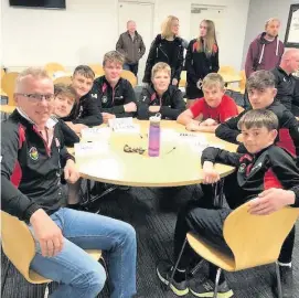  ??  ?? A number of players from Ammanford Under-15s FC are pictured having signed up for a refereeing course.