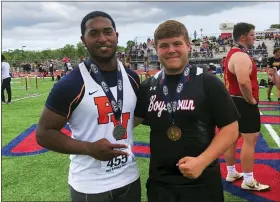  ?? ANDREW HELLER - MEDIANEWS GROUP ?? Perkiomen Valley senior Ronde Washington, left, and Boyertown senior Jayden Miller pose with their PIAA medals after their podium finishes in the shot put at the PIAA Track and Field Championsh­ips Friday at Shippensbu­rg University.