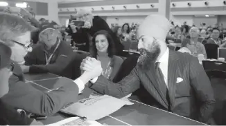  ??  ?? Jagmeet Singh, leader of the NDP, greets delegates at the NDP convention in Ottawa on Friday.