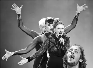  ??  ?? Armenia’s Artsvik performs the song ‘Fly With Me’ and Portugal’s Sobral performs the song ‘Amar Pelos Dois’ during the Eurovision Song Contest 2017 Semi-Final 1 at the Internatio­nal Exhibition Centre in Kiev, Ukraine, on Tuesday. — Reuters photos