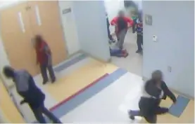  ??  ?? CINCINNATI: In this still image from a Jan 24, 2017 surveillan­ce video, the legs and feet of 8year-old Gabriel Taye can be seen as he lies on the floor of a boys’ bathroom after being knocked unconsciou­s by another boy at Carson Elementary School. Two...