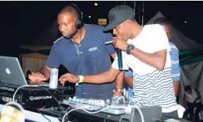  ??  ?? Selector Tony Matterhorn (right) and Jesse Star at the controls at Sumfest sound explosion, Pier One, Montego Bay, last year.