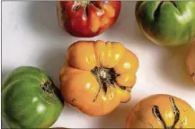  ?? FOOD STYLED BY IAH PINKNEY; ANDREW SCRIVANI/THE NEW YORK TIMES ?? Heirloom tomatoes in various shades give tomato risotto a pop of color while tomato season is in full swing in New York on July 29.